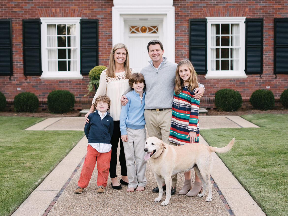 Regent University alumnus Sean Knox with his family and dog.